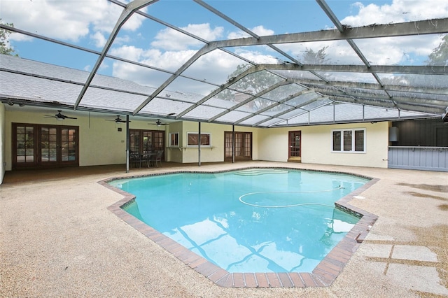 4128 Carrollwood Village Dr, Tampa, FL 33618 - outdoor pool with french doors, ceiling fan, a patio, and a lanai
