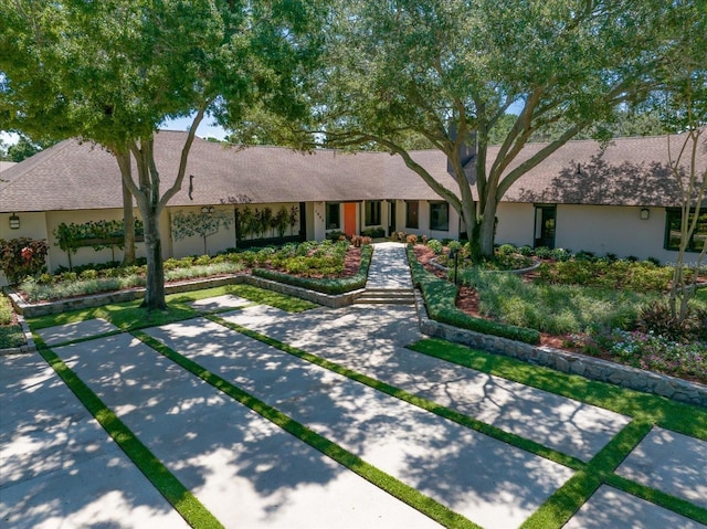 1835 Alicia Way, Clearwater, FL 33764 - view of front of house featuring stucco siding and roof with shingles