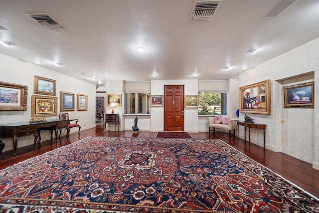 1835 Alicia Way, Clearwater, FL 33764 - living room featuring wood finished floors and tile walls