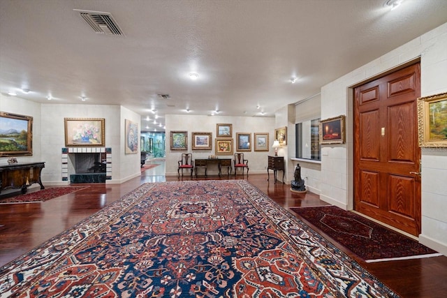 1835 Alicia Way, Clearwater, FL 33764 - entrance foyer with a fireplace and wood finished floors