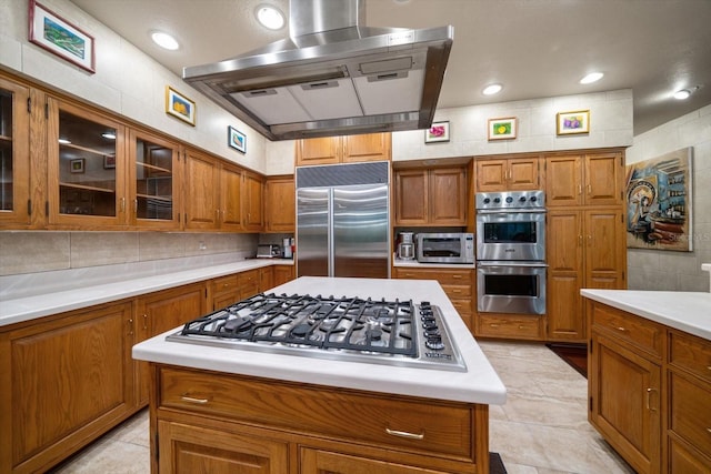 1835 Alicia Way, Clearwater, FL 33764 - kitchen featuring stainless steel appliances, wall chimney exhaust hood, brown cabinets, and light countertops