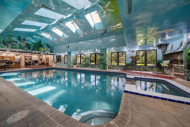 1835 Alicia Way, Clearwater, FL 33764 - view of swimming pool featuring a skylight, a pool with connected hot tub, area for grilling, and ceiling fan