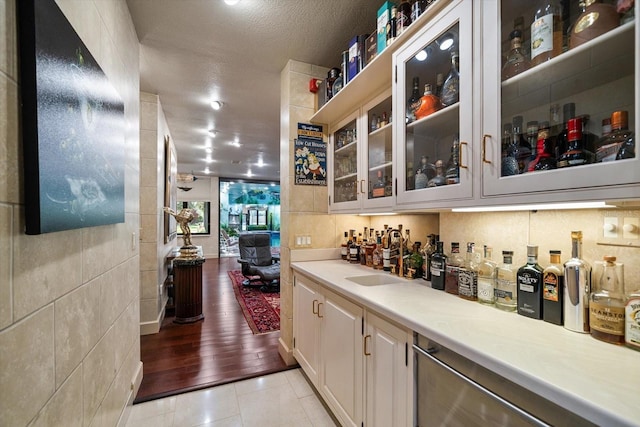 1835 Alicia Way, Clearwater, FL 33764 - indoor bar featuring dishwasher, light tile patterned flooring, and a textured ceiling