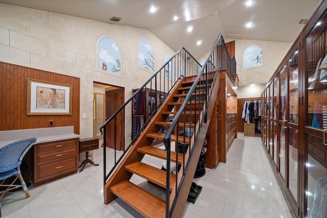 1835 Alicia Way, Clearwater, FL 33764 - staircase featuring tile patterned floors and lofted ceiling