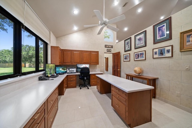 1835 Alicia Way, Clearwater, FL 33764 - office space featuring built in desk, light tile patterned floors, a ceiling fan, tile walls, and high vaulted ceiling