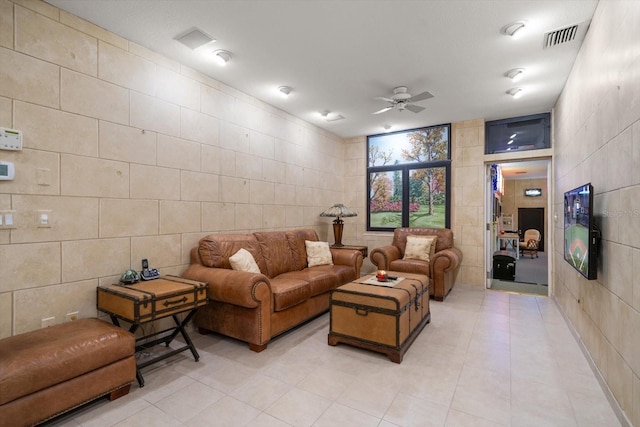 1835 Alicia Way, Clearwater, FL 33764 - living room with tile walls, light tile patterned floors, and ceiling fan