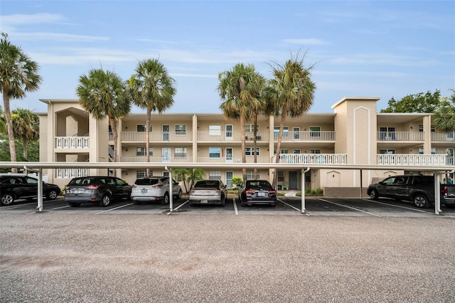 920 Virginia St Unit 204, Dunedin, FL 34698 - view of apartment building / complex with covered parking