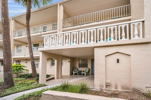 920 Virginia St Unit 204, Dunedin, FL 34698 - view of front of property with stucco siding