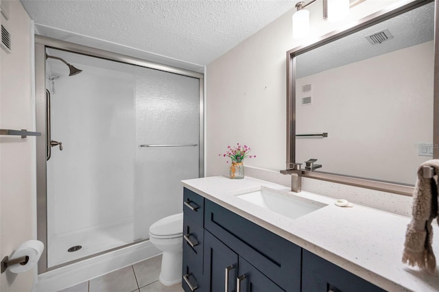 920 Virginia St Unit 204, Dunedin, FL 34698 - bathroom featuring vanity, a stall shower, tile patterned floors, and a textured ceiling