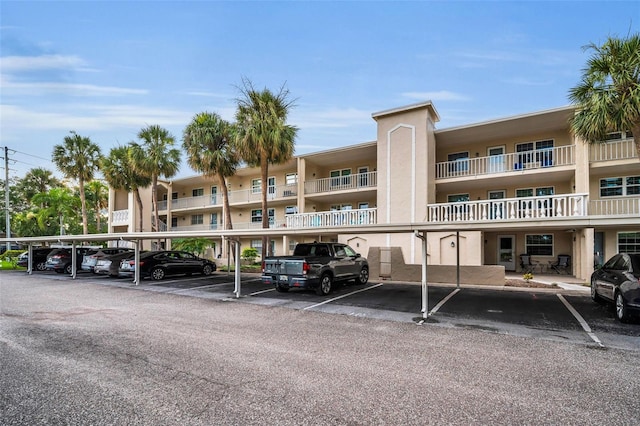 920 Virginia St Unit 204, Dunedin, FL 34698 - view of apartment building / complex with covered parking