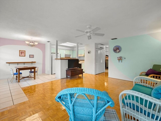 2357 Walton Cir Unit M6, Palm Harbor, FL 34683 - living area featuring ceiling fan, an AC wall unit, and arched walkways