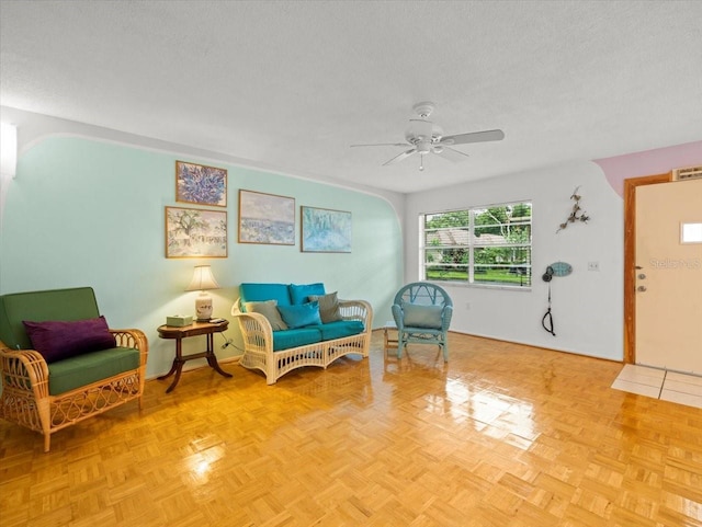 2357 Walton Cir Unit M6, Palm Harbor, FL 34683 - living area featuring a ceiling fan and a textured ceiling