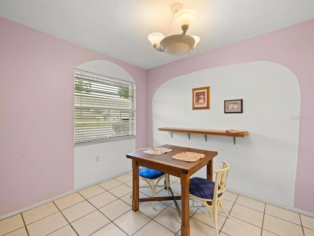 2357 Walton Cir Unit M6, Palm Harbor, FL 34683 - dining room featuring light tile patterned floors and a textured ceiling