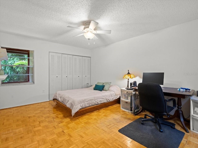 2357 Walton Cir Unit M6, Palm Harbor, FL 34683 - bedroom featuring a textured ceiling, a closet, an office area, and ceiling fan
