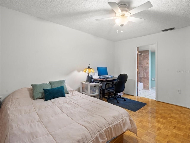 2357 Walton Cir Unit M6, Palm Harbor, FL 34683 - bedroom featuring a textured ceiling, ceiling fan, and ensuite bath