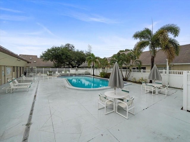 2357 Walton Cir Unit M6, Palm Harbor, FL 34683 - community pool featuring a fenced backyard and a patio