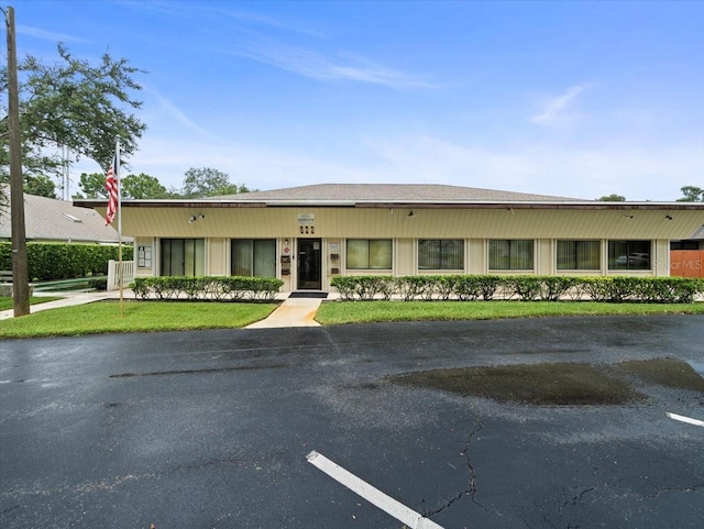 2357 Walton Cir Unit M6, Palm Harbor, FL 34683 - view of front of property featuring uncovered parking and a front lawn