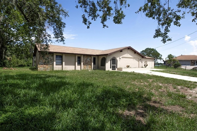 271 Eastpoint Ct, Spring Hill, FL 34606 - single story home featuring concrete driveway, stucco siding, a garage, stone siding, and a front lawn