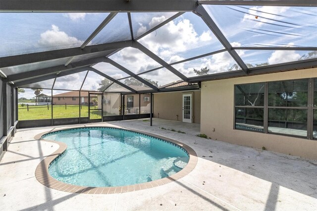 271 Eastpoint Ct, Spring Hill, FL 34606 - outdoor pool featuring a patio and glass enclosure