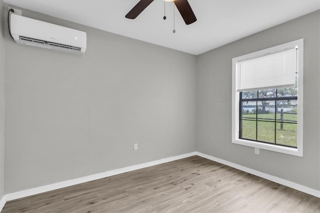 271 Eastpoint Ct, Spring Hill, FL 34606 - unfurnished room featuring an AC wall unit, wood finished floors, and ceiling fan