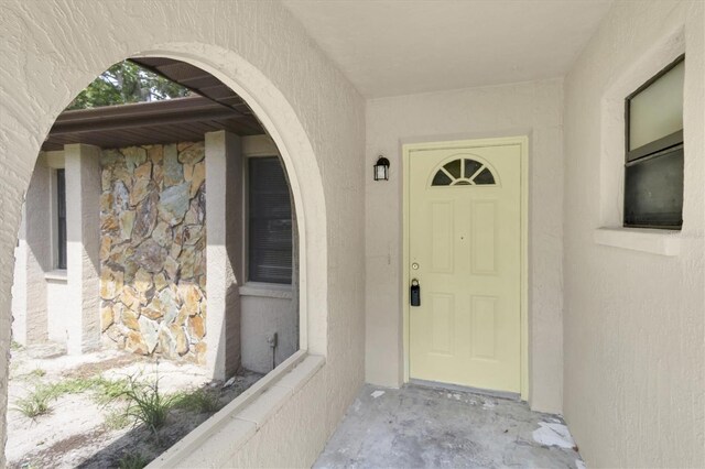 271 Eastpoint Ct, Spring Hill, FL 34606 - property entrance with stucco siding and stone siding