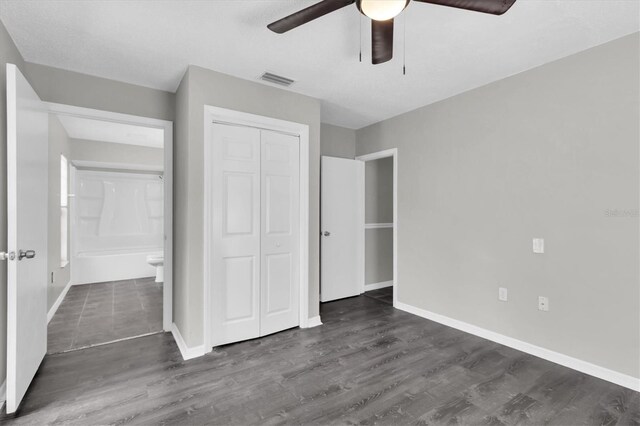 271 Eastpoint Ct, Spring Hill, FL 34606 - unfurnished bedroom with a closet, dark wood-style floors, and ceiling fan