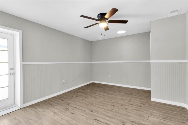 271 Eastpoint Ct, Spring Hill, FL 34606 - empty room with a ceiling fan, wood finished floors, and plenty of natural light