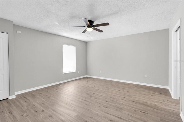 271 Eastpoint Ct, Spring Hill, FL 34606 - unfurnished bedroom with wood finished floors, a textured ceiling, and ceiling fan