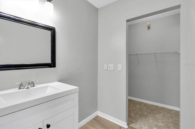 271 Eastpoint Ct, Spring Hill, FL 34606 - bathroom featuring vanity and a spacious closet