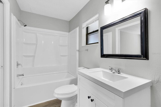 271 Eastpoint Ct, Spring Hill, FL 34606 - bathroom with vanity, tub / shower combination, and wood finished floors