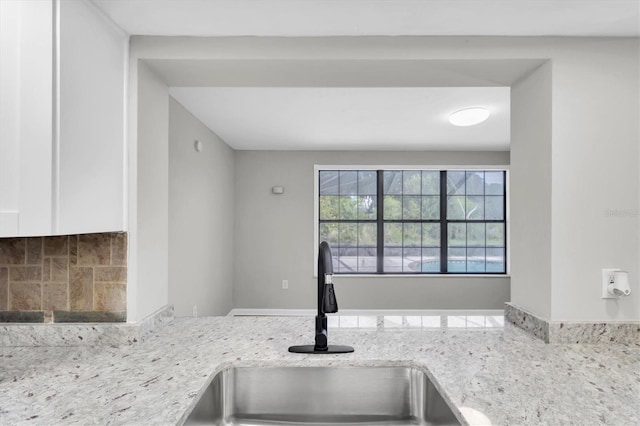271 Eastpoint Ct, Spring Hill, FL 34606 - kitchen view of white cabinetry and light stone counters