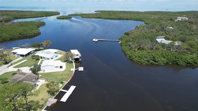 6711 Arroyo Dr, New Port Richey, FL 34652 - aerial overview of property's location featuring a nearby body of water and a heavily wooded area