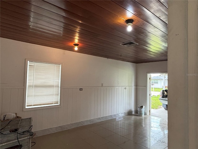 6711 Arroyo Dr, New Port Richey, FL 34652 - garage featuring wainscoting and wood ceiling