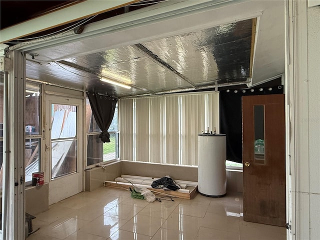 6711 Arroyo Dr, New Port Richey, FL 34652 - basement featuring water heater and tile patterned floors