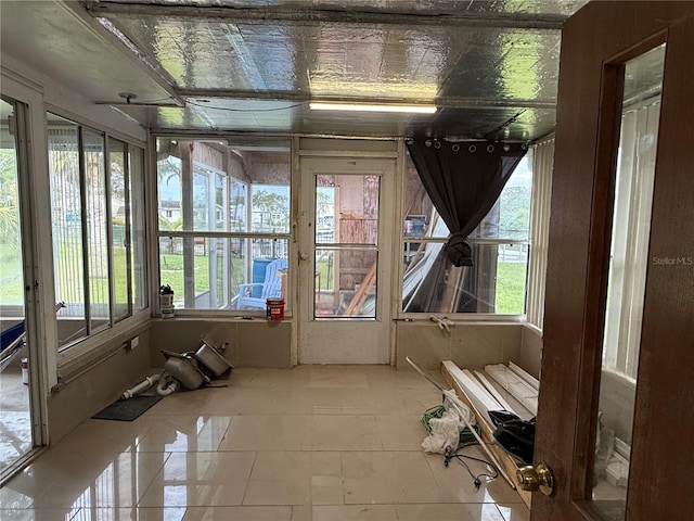 6711 Arroyo Dr, New Port Richey, FL 34652 - sunroom featuring plenty of natural light and tile patterned floors