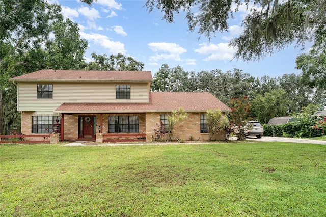 11414 Donneymoor Dr, Riverview, FL 33569 - view of front of property with brick siding, a front lawn, covered porch, and driveway