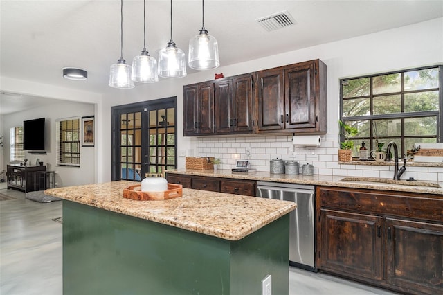 11414 Donneymoor Dr, Riverview, FL 33569 - kitchen featuring dishwasher, a center island, backsplash, concrete flooring, and dark brown cabinetry