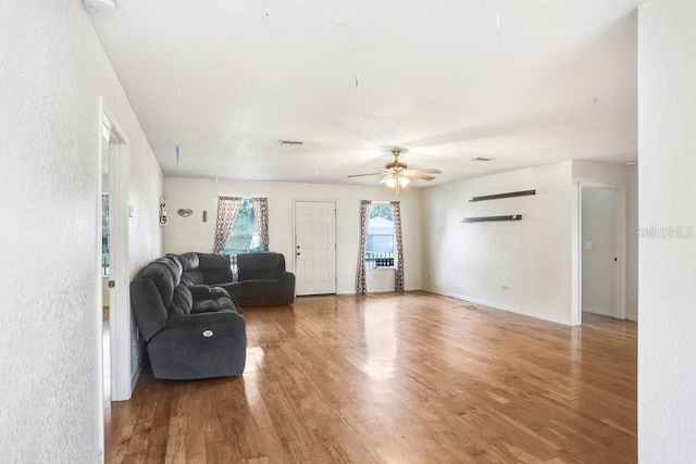 7841 Royal Stewart Dr, New Port Richey, FL 34653 - living room with light wood-type flooring and a ceiling fan
