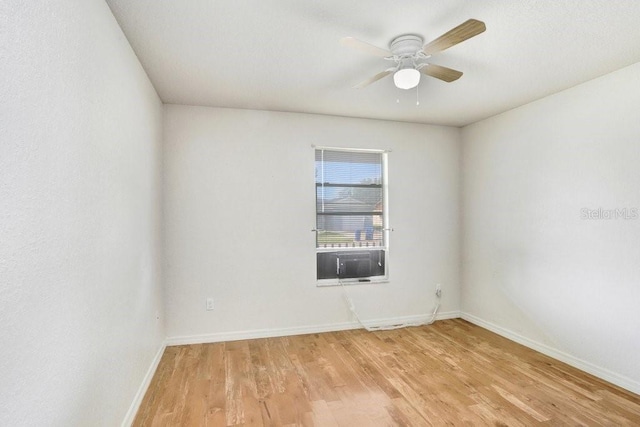 7841 Royal Stewart Dr, New Port Richey, FL 34653 - spare room with light wood-style floors, a ceiling fan, and cooling unit