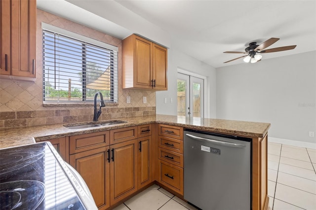 1724 Adams Cir S, Largo, FL 33771 - kitchen featuring dishwasher, ceiling fan, backsplash, light tile patterned floors, and a peninsula