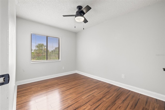 1724 Adams Cir S, Largo, FL 33771 - empty room with wood finished floors, a textured ceiling, and ceiling fan