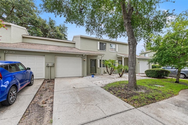 1724 Adams Cir S, Largo, FL 33771 - multi unit property with driveway, stucco siding, and an attached garage