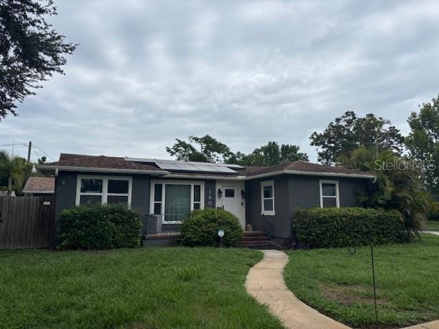 1601 14th St N, Saint Petersburg, FL 33704 - view of front of house with roof mounted solar panels