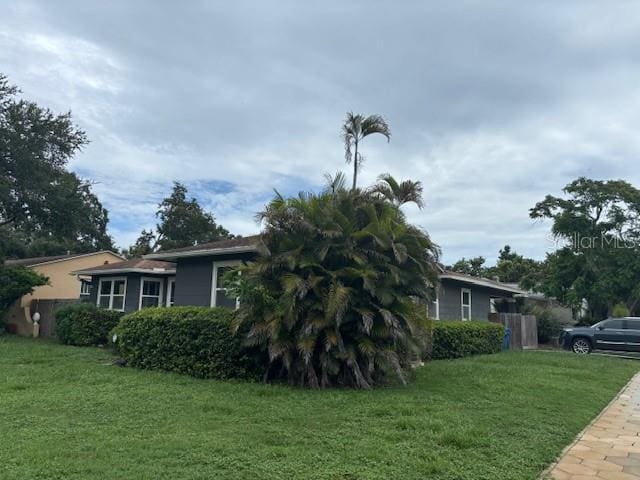 1601 14th St N, Saint Petersburg, FL 33704 - view of home's exterior featuring a yard
