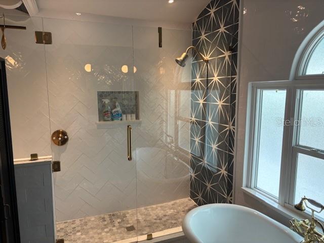 1601 14th St N, Saint Petersburg, FL 33704 - full bathroom with a freestanding tub and a shower stall