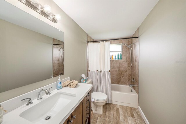 15525 Old Dixie Hwy, Hudson, FL 34667 - bathroom with vanity, wood finished floors, and shower / tub combo with curtain