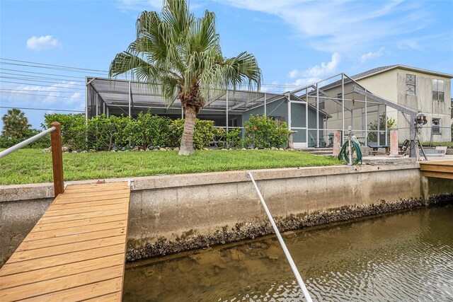 15525 Old Dixie Hwy, Hudson, FL 34667 - dock area with a water view, a yard, and a lanai