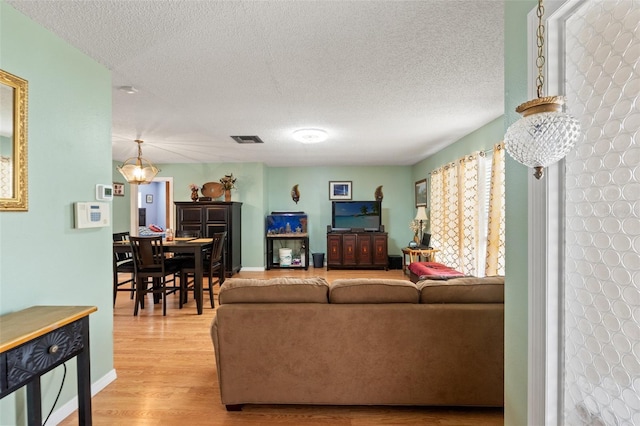 9171 Horizon Dr, Spring Hill, FL 34608 - living room featuring wood finished floors and a textured ceiling