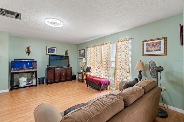 9171 Horizon Dr, Spring Hill, FL 34608 - living area with wood finished floors and a textured ceiling