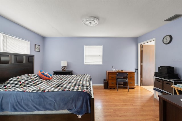 9171 Horizon Dr, Spring Hill, FL 34608 - bedroom with wood finished floors and an office area